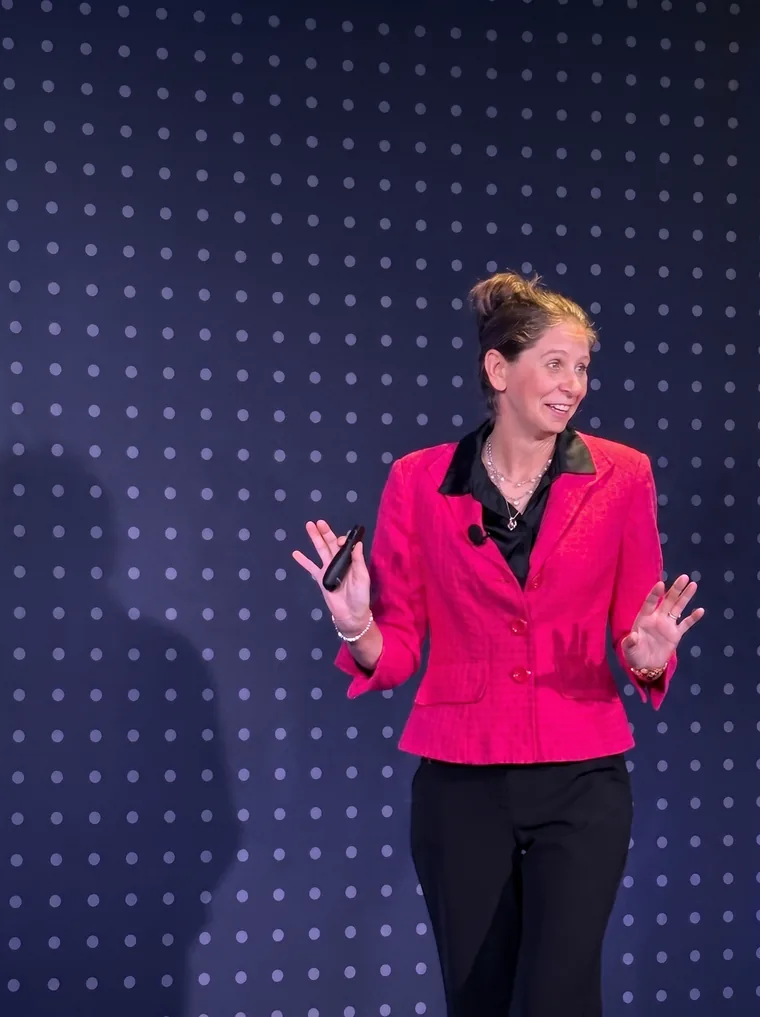 Jennifer Bennett speaking on stage